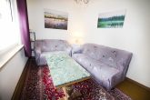 Gepflegtes Massivhaus mit Terrasse & Garage – Ideal als Ferienimmobilie - Wohnzimmer