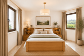 Wohnen auf einer Ebene mit Einliegerwohnung, Wellnessbereich und traumhaftem Garten in der Eifel - KI Schlafzimmer Anliegerwohnung