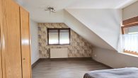 Attraktives Mehrfamilienhaus mit ca. 7 % Rendite in Pünderich - Schlafzimmer W2