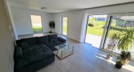 Modernes Einfamilienhaus im Hunsrück – Neubau mit großem Garten & KfW-40-Standard - Wohnzimmer
