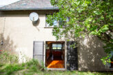 Perfektes Einfamilienhaus mit Garten und Garage - Rückansicht