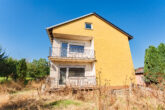 Einfamilienhaus, aufteilbar in zwei Wohneinheiten in ruhiger Lage in der Eifel - Rückansicht